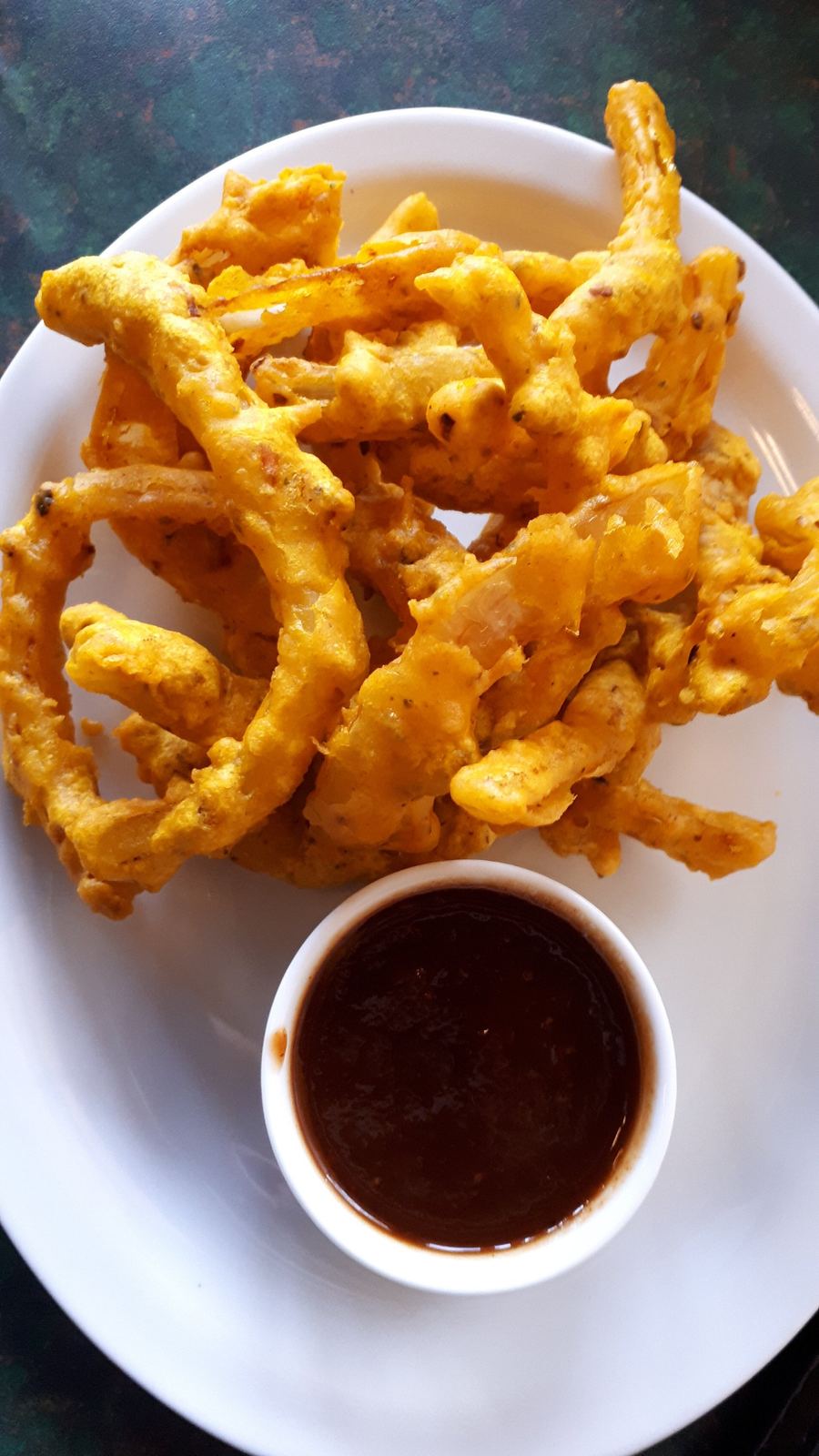 Crisp onion bhajia with tamarind dipping sauce